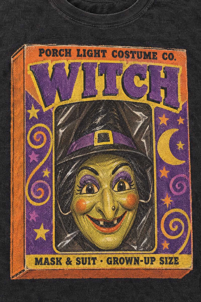 Washed black tee printed with a vintage boxed witch costume, a plastic witch mask behind a cellophane window, words Porch Light Costume Co., Witch, Mask & Suit, Grown-Up Size